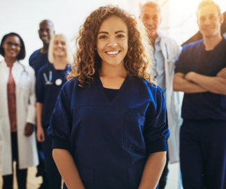 lady standing in front of a group of health workers