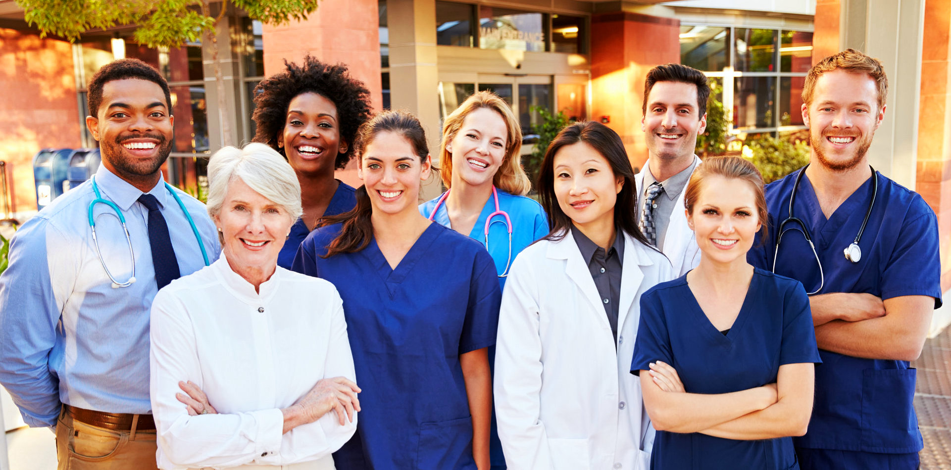 group of health workers smiling together