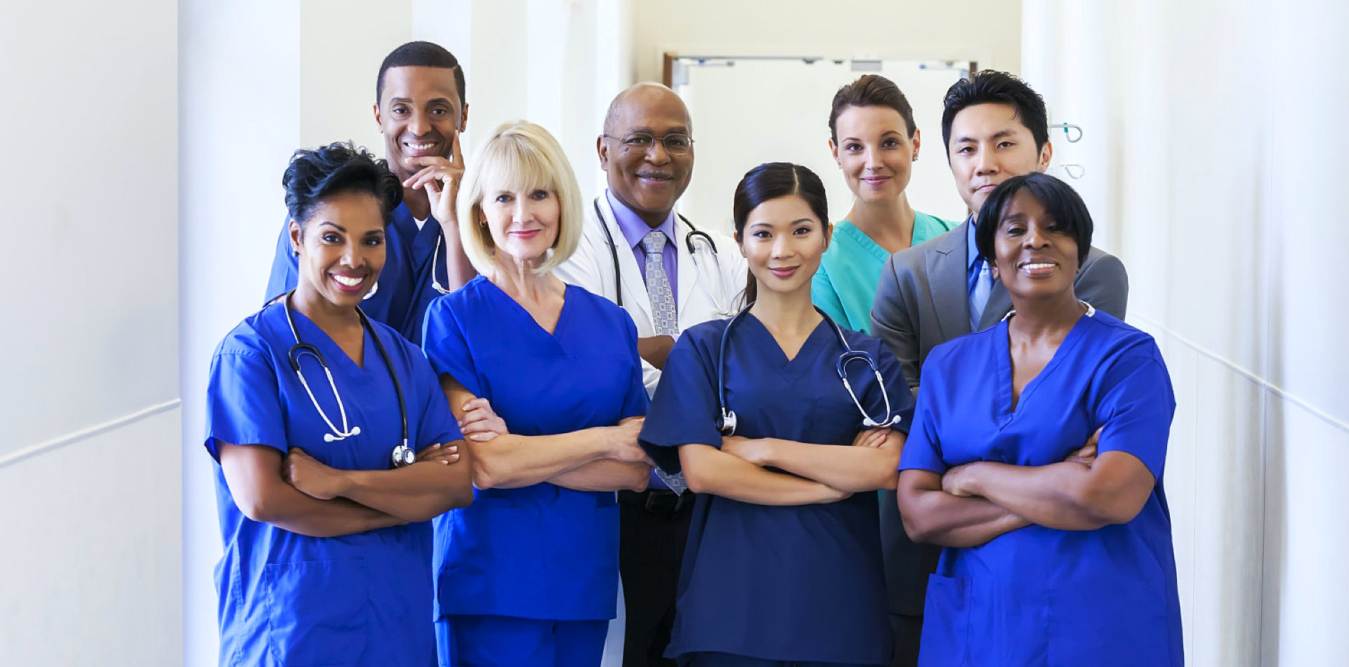 group of nurses crossing their arms and posing together